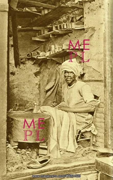 : Arab cobbler at work in his shop, Cairo, Egypt : Arab cobbler at work in his shop, Cairo, Egypt
