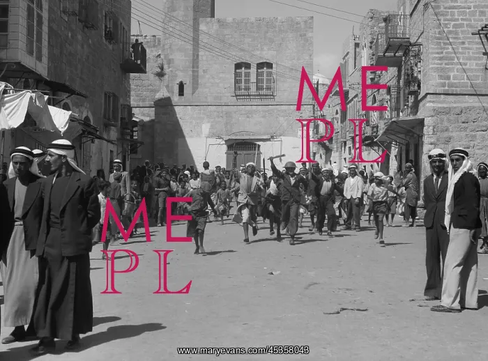 : Arab youths running in Bethlehem after burning government : Arab youths running in Bethlehem after burning government