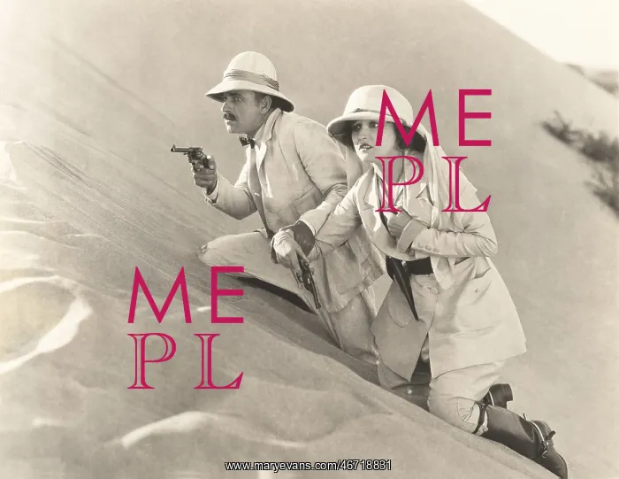 : Armed couple climbing up sand dune : Armed couple climbing up sand dune