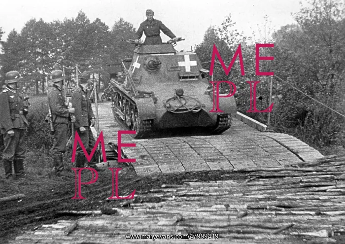 : An armored command post vehicleI B crosses a bridge : An armored command post vehicleI B crosses a bridge