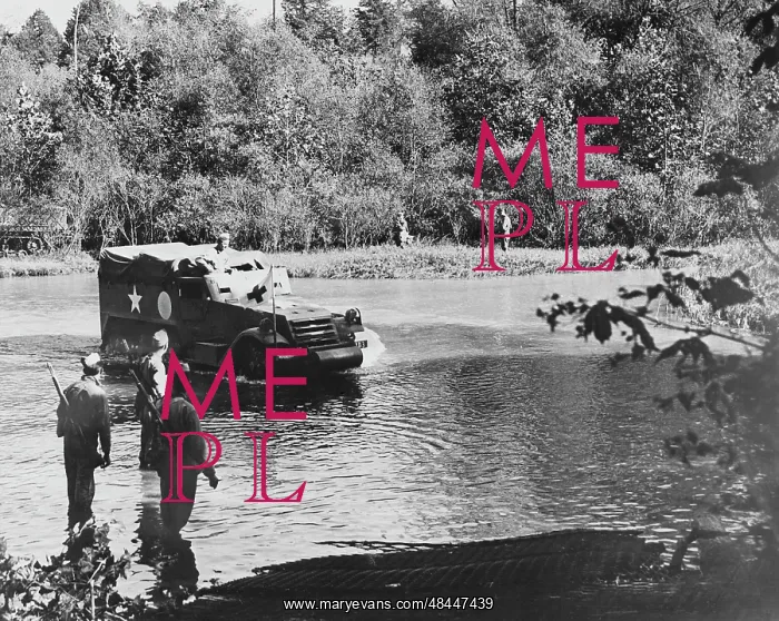 : An armored half-track vehicle crossing the : An armored half-track vehicle crossing the