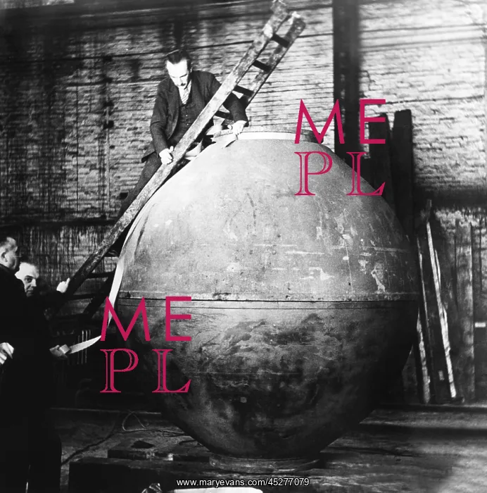 : Auguste Piccard on a ladder examining the nacelle : Auguste Piccard on a ladder examining the nacelle