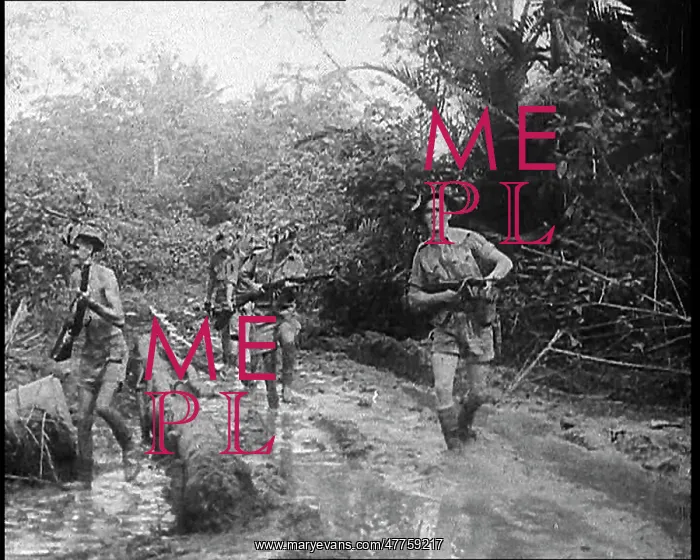: Australian Troops Trudging Through Mud in New Guinea : Australian Troops Trudging Through Mud in New Guinea