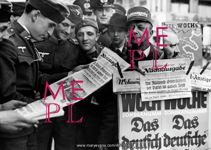 : Austrian soldiers read newspapers in Berlin, 1938 : Austrian soldiers read newspapers in Berlin, 1938