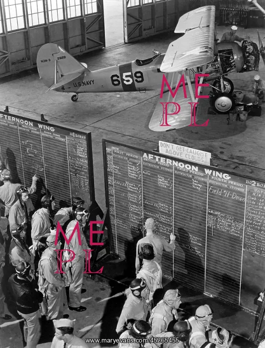 : Aviation cadets check flight boards for last minute : Aviation cadets check flight boards for last minute