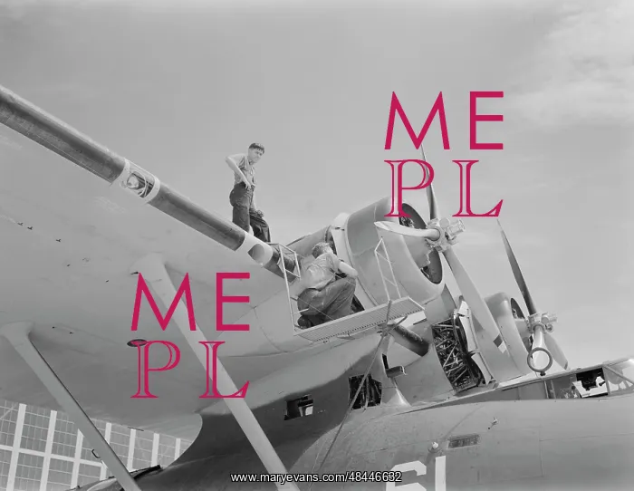 : Aviation mechanics check the huge motor on : Aviation mechanics check the huge motor on