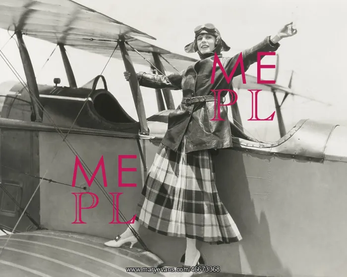  : Aviatrix standing on bi-plane
