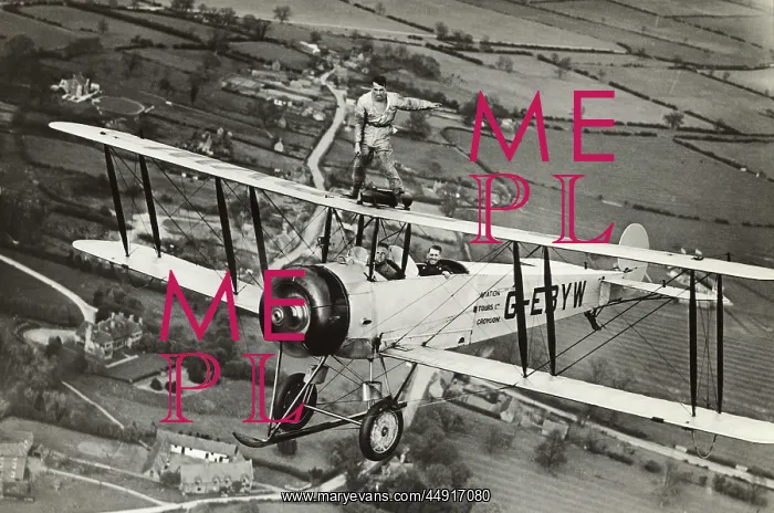 : Avro 504K. Wing-Walking on an Avro 504K Flying over Fields : Avro 504K. Wing-Walking on an Avro 504K Flying over Fields