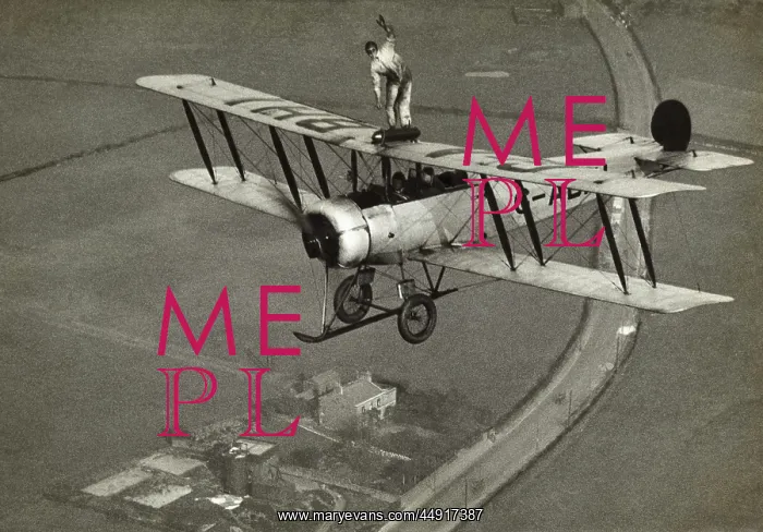 : Avro 504K. Wing-Walking on an Avro 504K Flying over Fields : Avro 504K. Wing-Walking on an Avro 504K Flying over Fields