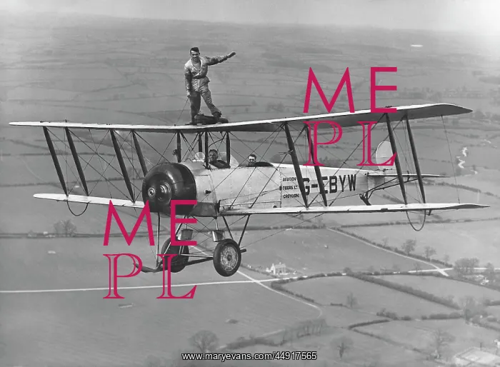 : Avro 504K. A Man Wing-Walking on an Avro 504K of Cobham's National Aviation Day Flypast : Avro 504K. A Man Wing-Walking on an Avro 504K of Cobham's National Aviation Day Flypast