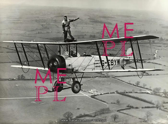 : Avro 504K. Wing-Walking on an Avro 504K Flying over Fields : Avro 504K. Wing-Walking on an Avro 504K Flying over Fields