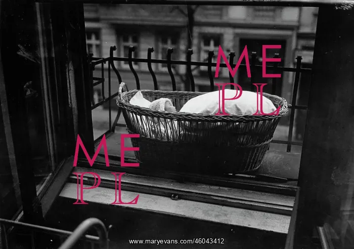 : Baby in basket on windowsill : Baby in basket on windowsill