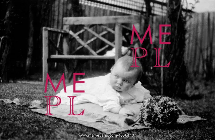  : Baby lying in the garden