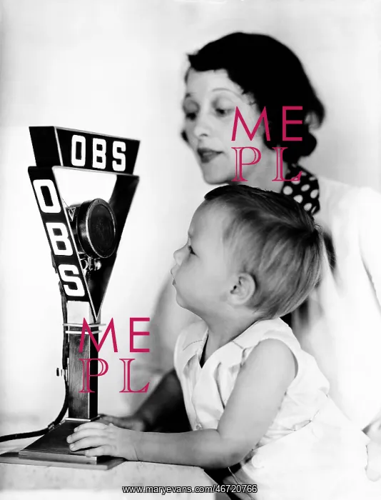 : Baby and mother with radio microphone : Baby and mother with radio microphone