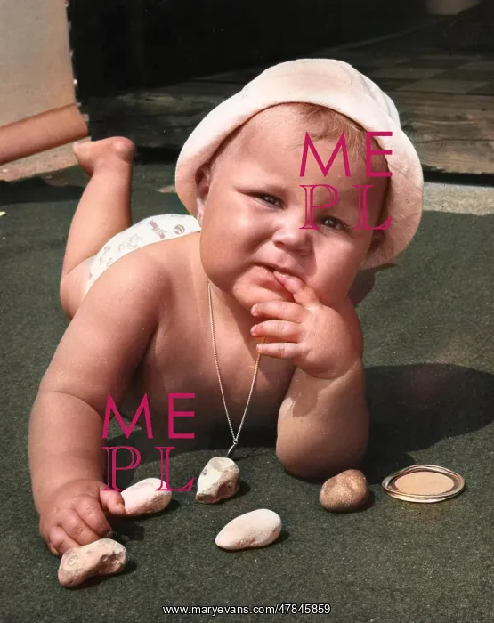: Baby playing with pebbles : Baby playing with pebbles