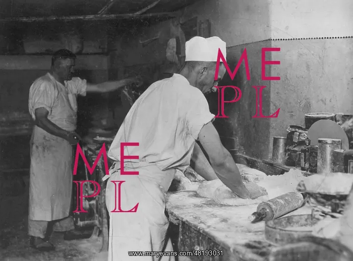: Baker kneads dough, 1929 : Baker kneads dough, 1929