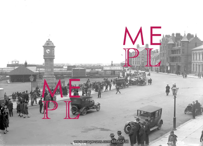 : Bangor - an elevated view of the McKee clock and Quay street, there are people sitting : Bangor - an elevated view of the McKee clock and Quay street, there are people sitting