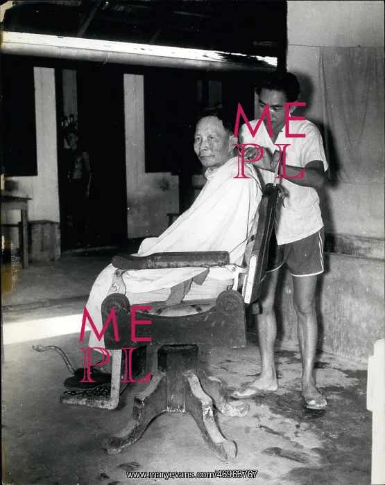 : Barber at work in leprosy settlement, Sarawak : Barber at work in leprosy settlement, Sarawak