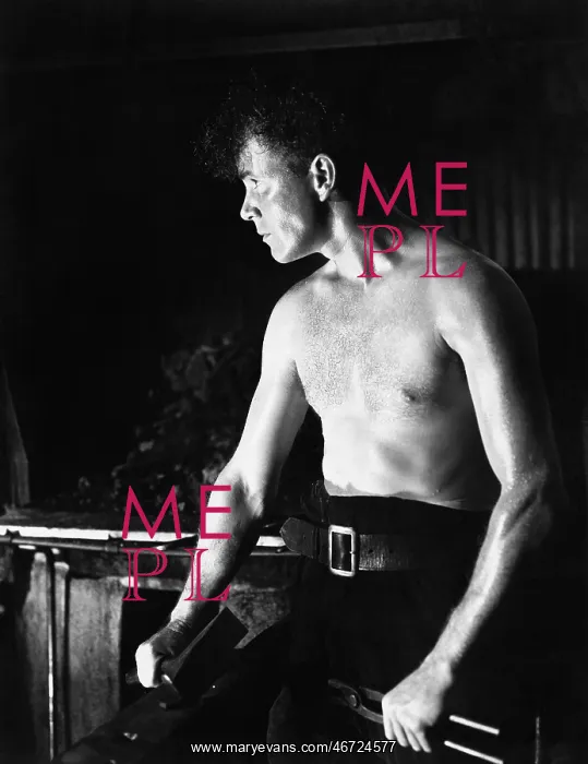 : Bare chested man sitting and holding tools in his hands : Bare chested man sitting and holding tools in his hands