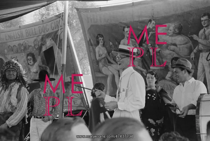 : Barker at sideshow with performers, state fair, Donaldsonvil : Barker at sideshow with performers, state fair, Donaldsonvil