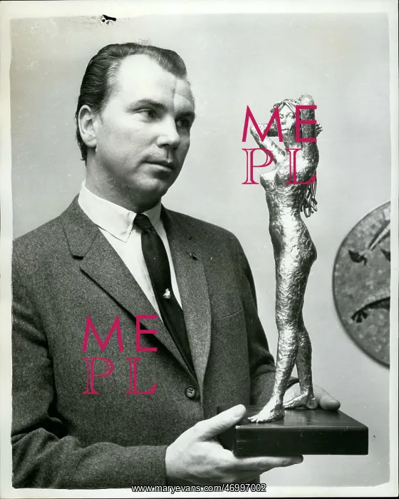 : Baron Joseph Dobronyi, sculptor, with Bardot statuette : Baron Joseph Dobronyi, sculptor, with Bardot statuette