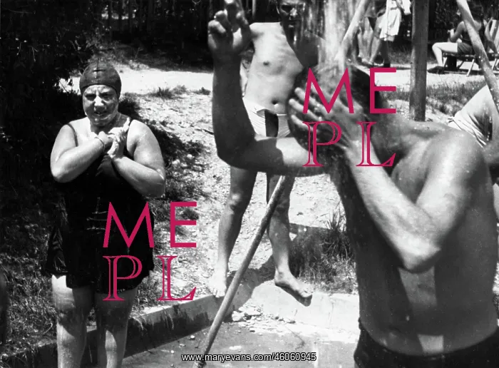 : Some bathers are taking a shower : Some bathers are taking a shower