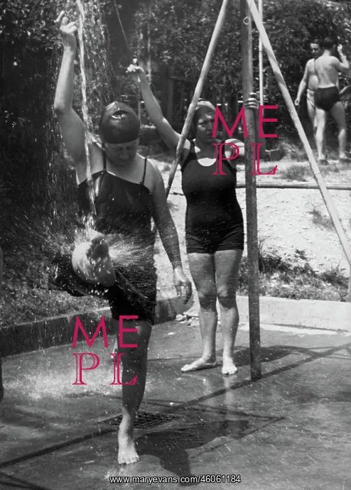 : Some bathers are taking a shower : Some bathers are taking a shower