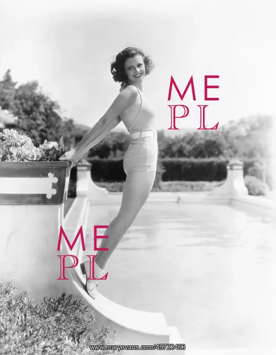  : Bathing beauty posing by the pool