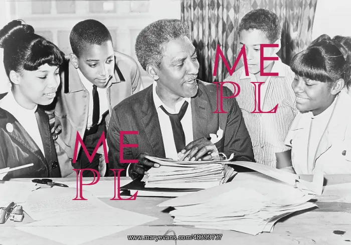 : Bayard Rustin speaking with young adults before : Bayard Rustin speaking with young adults before