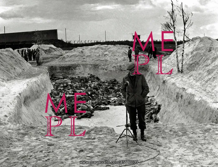 : BBC reporter in front of mass grave at Bergen-Belsen : BBC reporter in front of mass grave at Bergen-Belsen