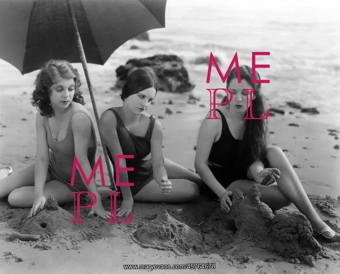 : Beach beauties making sand castles : Beach beauties making sand castles
