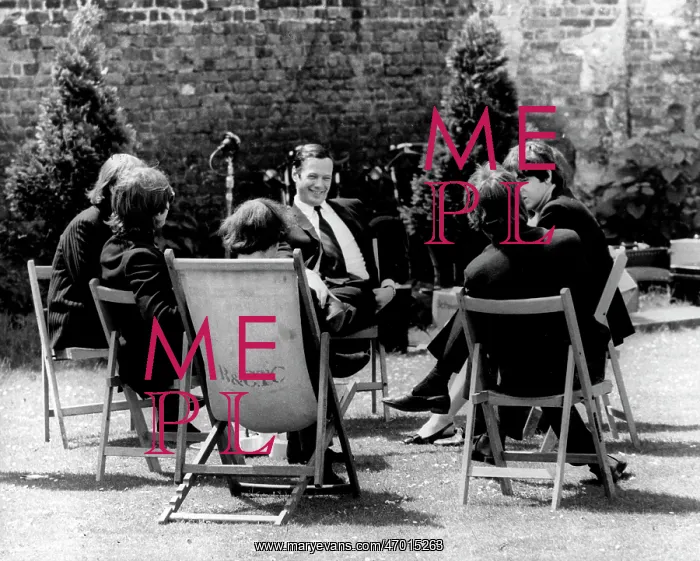 : The Beatles and manager Brian Epstein taking a break : The Beatles and manager Brian Epstein taking a break