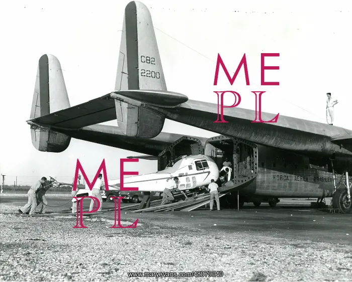 : A Bell Model 47J being loaded into a Fairchild C-82 of t : A Bell Model 47J being loaded into a Fairchild C-82 of t