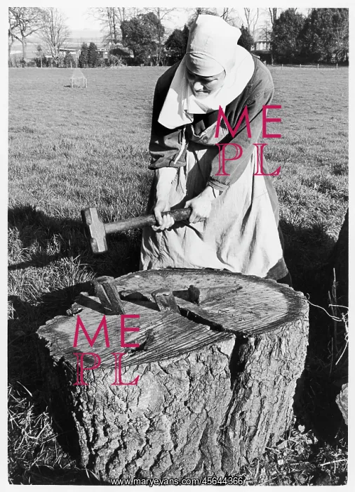 : Benedictine nun chopping firewood, St Cecilia's Abbey : Benedictine nun chopping firewood, St Cecilia's Abbey