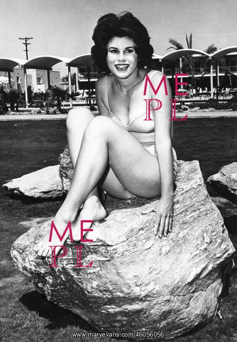 : A bikini-clad woman : A bikini-clad woman