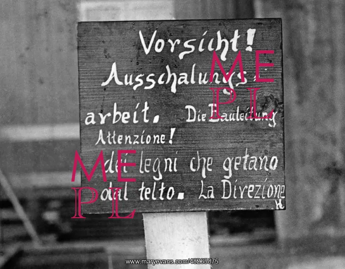 : Bilingual warning sign at the Volkswagen construction site : Bilingual warning sign at the Volkswagen construction site