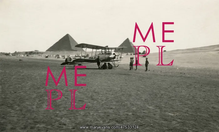 : A biplane in the Egyptian desert, with the pyramids : A biplane in the Egyptian desert, with the pyramids