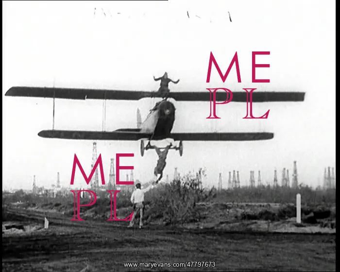 : A Biplane With A Wing Walker Sitting On Top : A Biplane With A Wing Walker Sitting On Top