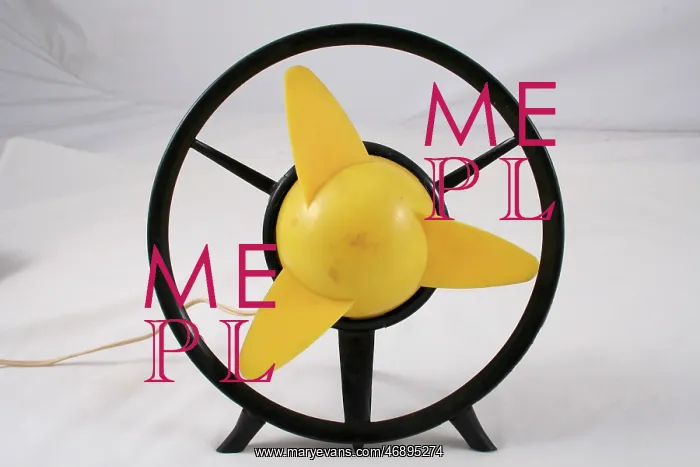 : Black framed fan, yellow centre, funky design : Black framed fan, yellow centre, funky design