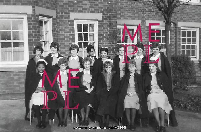: Black nurses amongst white nurses having a group picture : Black nurses amongst white nurses having a group picture