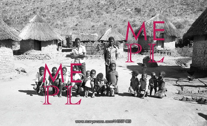 : Black and white photo of children posing in front : Black and white photo of children posing in front
