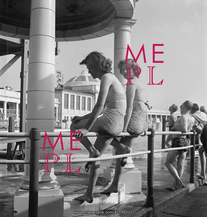 : Blackpool. Two girls in bathing suits sitting on railings at the Blackpool Lido : Blackpool. Two girls in bathing suits sitting on railings at the Blackpool Lido
