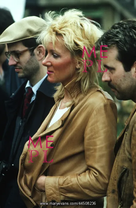 : Bleached blond lady in tan leather jacket : Bleached blond lady in tan leather jacket