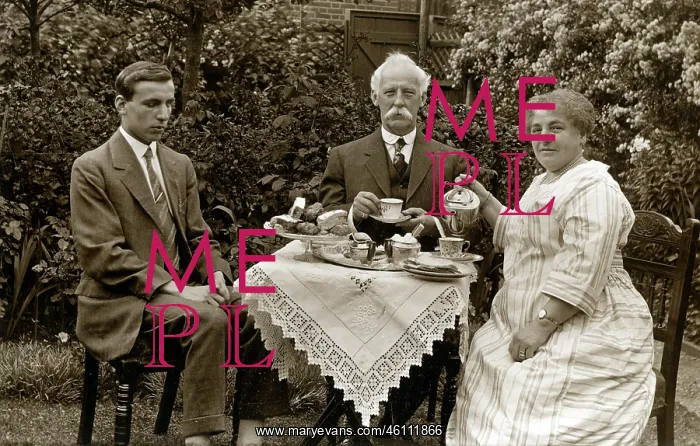 : Blind man at tea table in a garden : Blind man at tea table in a garden