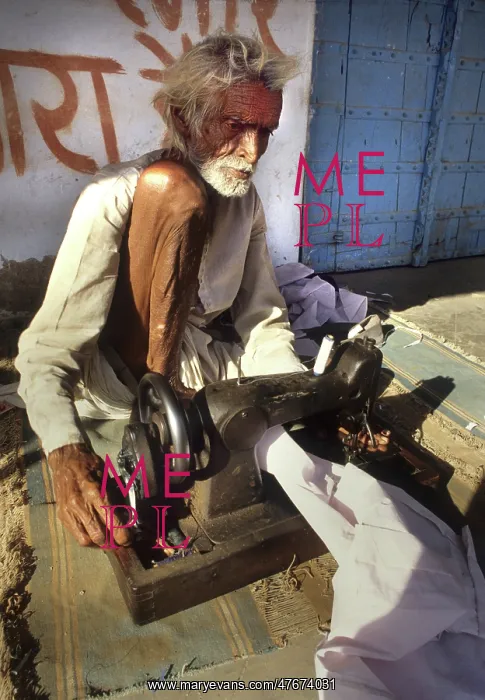 : A blind man working a sewing machine, Rajasthan, India : A blind man working a sewing machine, Rajasthan, India
