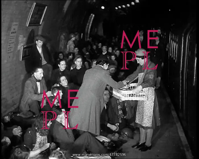 : The Blitz. Civilians Receiving Supplies While Sheltering From Bombs in : The Blitz. Civilians Receiving Supplies While Sheltering From Bombs in