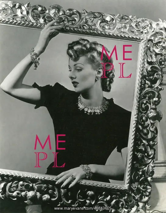 : Blonde 1940s model in black top behind picture frame : Blonde 1940s model in black top behind picture frame