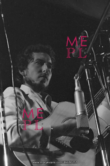 : Bob Dylan performing at a Music Festival : Bob Dylan performing at a Music Festival