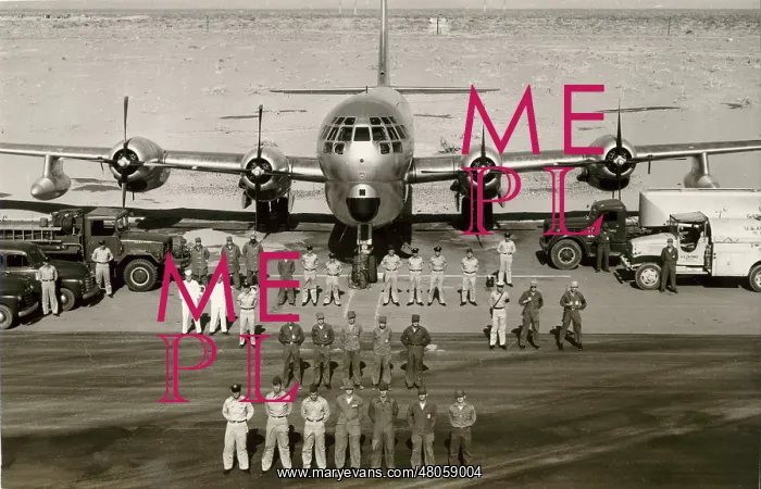 : A Boeing C-97 poses with its groundcrew : A Boeing C-97 poses with its groundcrew