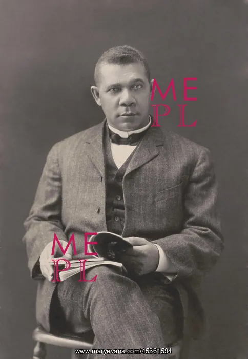 : Booker T. Washington sits with books on his lap : Booker T. Washington sits with books on his lap